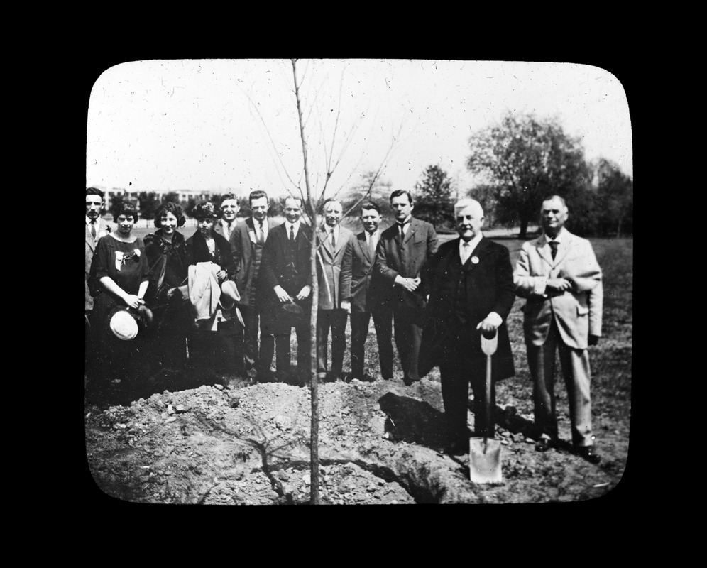 Mayor Bates planting tree at Washington D.C.