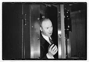 A man demonstrating how to break into a safe