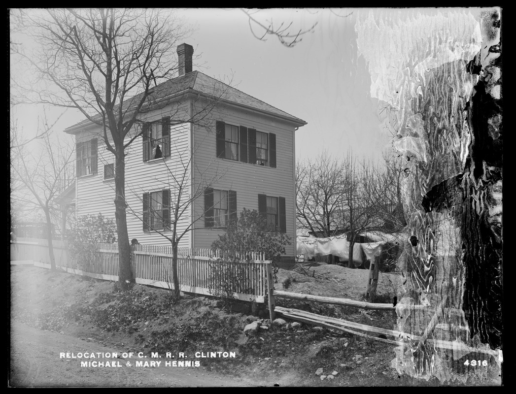 Relocation Central Massachusetts Railroad, Michael and Mary Hennis' house and barn, looking westerly along the Railroad line, Clinton, Mass., Apr. 28, 1902