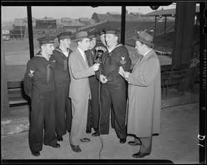 Leo Egan of WNAC with sailors at Braves Field