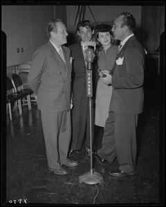 Herbert J. Biberman, Nancy Gates, Eric Feldary, and an unidentified man promoting The Master Race movie at WNAC