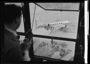 American Airlines traffic control tower. View of airplane on tarmac from tower