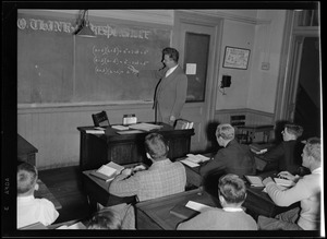 Boston English football. Coach Bill Ohrenberger teaches a math class