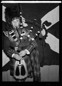 Musicians from the Scottish Highlanders Pipe Band playing bagpipes