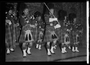 Musicians from the Scottish Highlanders Pipe Band playing bagpipes