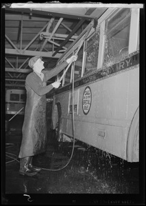 Man washing a bus