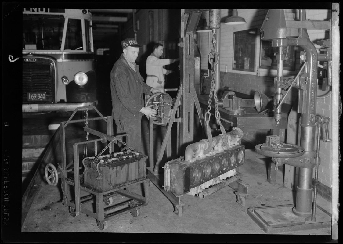 Two men in mechanics shop