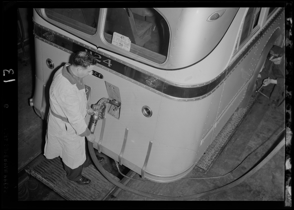 Man putting gas in a bus