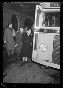 People boarding a bus
