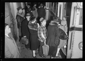 People lined up to board a bus