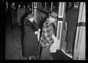 People boarding a bus