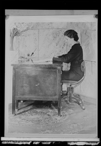 Do/More Chairs advertisement, woman seated at a desk