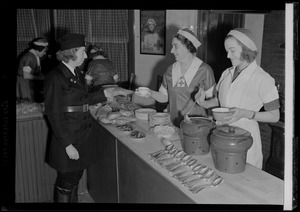 Red Cross workers serving a meal