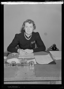 Portrait of Miss Johnson seated at desk