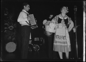 International Institute Costume Ball, singer and accordion player
