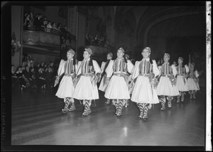 International Institute Costume Ball, men in costume marching in lines