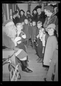 Filene's Toy Dept. Christmas, children gathered around Santa