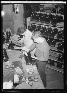 Filene's Toy Dept. Christmas, men working on toy trains