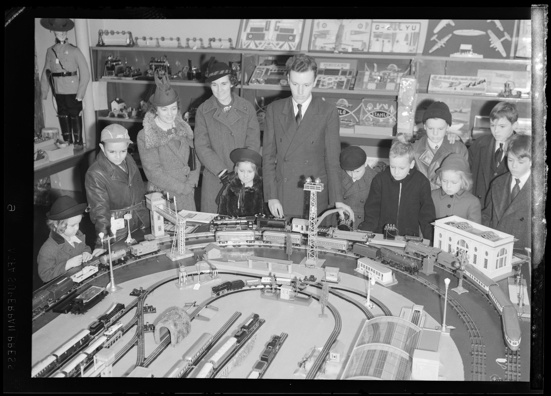 Filene's Toy Dept. Christmas, crowd looks at toy train set