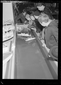 Filene's Toy Dept. Christmas, group of children look at toy boats on water
