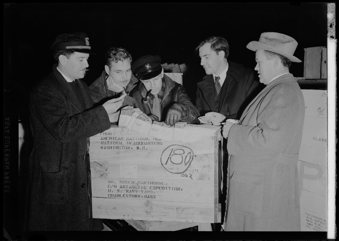 Checking supplies for Admiral Byrd's Antarctic expedition at Charlestown Naval Shipyard