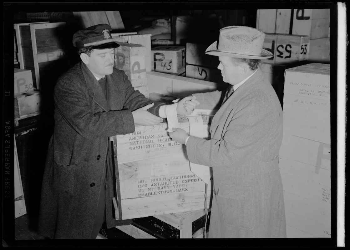 Checking supplies for Admiral Byrd's Antarctic expedition at Charlestown Naval Shipyard