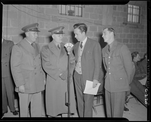 Four men at CBS microphone