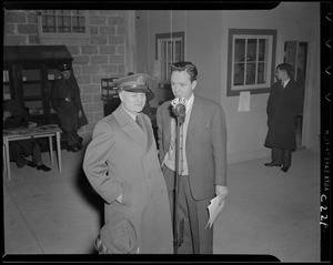 Two men in front of CBS microphone