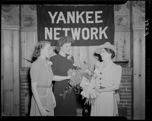 Palmolive winner Mrs. Sherin receiving flowers