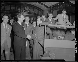 Jim Britt shakes hands with Pvt. Frank Jones