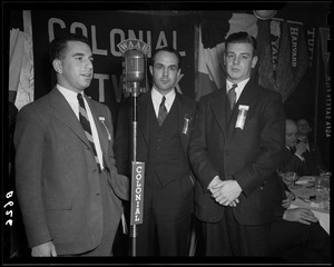 Unsung heroes with their coach at the WAAB Colonial Network microphone