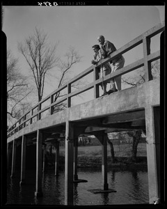 Cedric Foster and his daughter standing on Old North Bridge