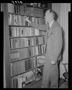 Cedric Foster at bookshelf