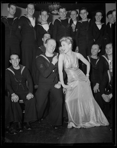 Mrs. Warren and servicemen singing and dancing