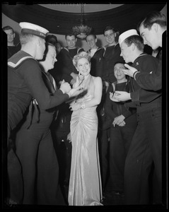 Mrs. Warren posing with servicemen