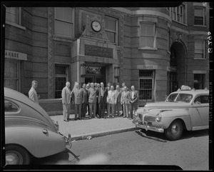 Men outside Colonial Network building