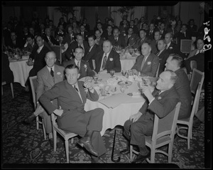 Group of men at table at Copley FM show