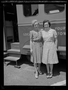 Women in front of public telephone bus from the New Hampshire Telephone Company at the Portsmouth Navy Yard