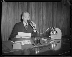 Broadcaster at desk