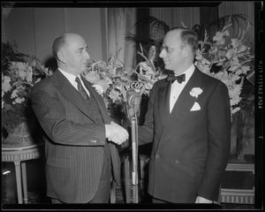 Two men shaking hands at Copley dinner party