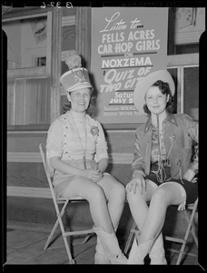 Carhop waitresses with a sign promoting Quiz of Two Cities