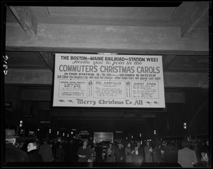 Commuters Christmas carols at North Station