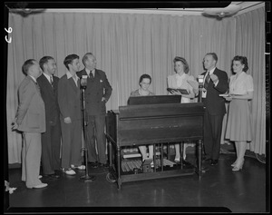 Performers singing with an organ