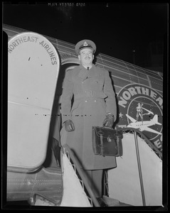 Lt. Gilchrist disembarking airplane