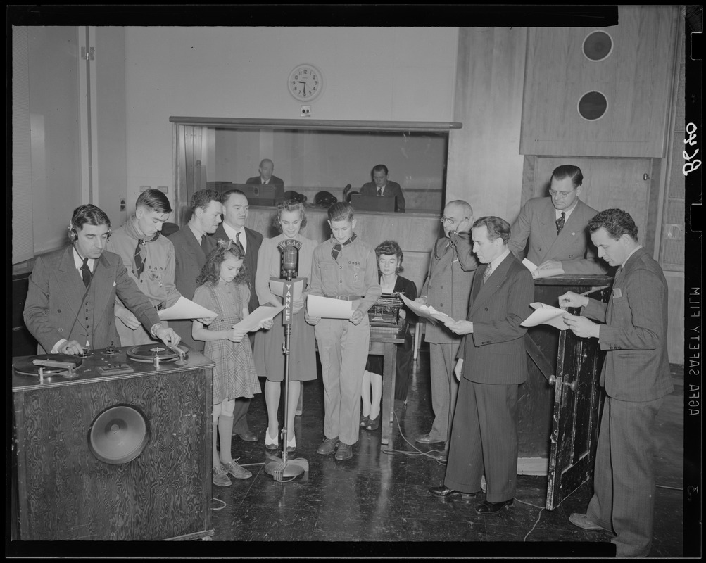 Boy Scouts receive a certificate during radio show