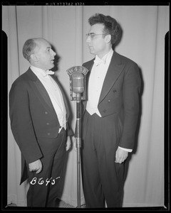 Two men at microphone at the N. E. Mutual Concert