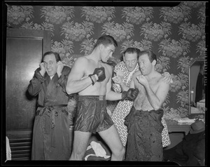 Sammy Angott and the Ritz Brothers, likely a National Boxing Association promotional event for Angott's upcoming fight with Sugar Ray Robinson
