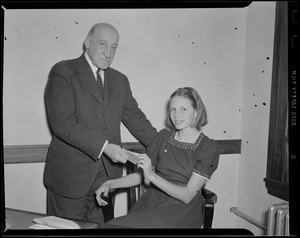Dr. Cabot hands off tickets to Russian war relief event
