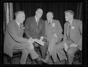 Four men at an event