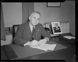 Portrait of Dr. Brownville or Mr. Elliot at desk